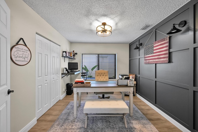 23283 Boca Trace Dr, Boca Raton, FL 33433 - office space featuring light wood-style flooring, a textured ceiling, and baseboards