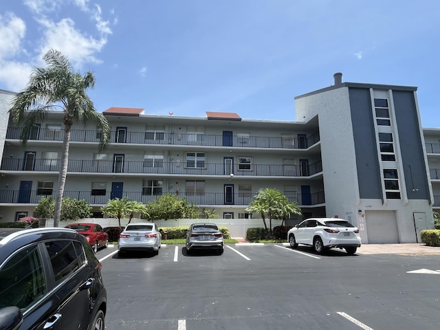 14701 Cumberland Dr # 301, Delray Beach, FL 33446 - view of apartment building / complex with uncovered parking