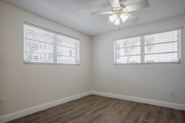 1673 Bay Rd Unit 206, Miami Beach, FL 33139 - spare room featuring wood finished floors, ceiling fan, a textured ceiling, and baseboards