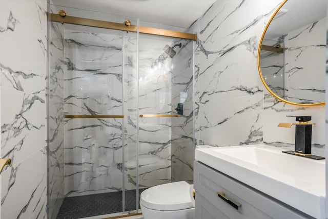 1673 Bay Rd Unit 206, Miami Beach, FL 33139 - full bathroom featuring vanity, toilet, a marble finish shower, and tile walls