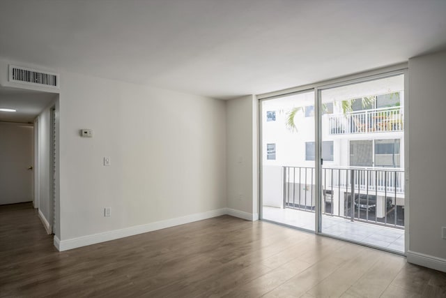 1673 Bay Rd Unit 206, Miami Beach, FL 33139 - unfurnished room with wood finished floors and baseboards