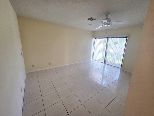 1731 Presidential Way Unit C201, West Palm Beach, FL 33401 - spare room with ceiling fan, light tile patterned floors, and a textured ceiling