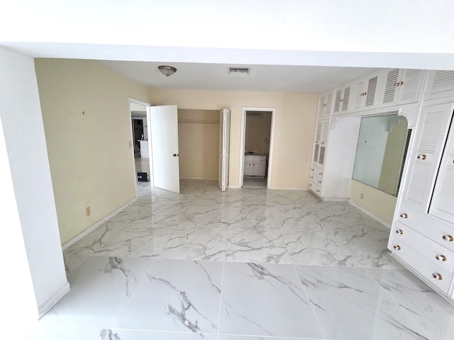 1731 Presidential Way Unit C201, West Palm Beach, FL 33401 - empty room featuring light marble finish flooring
