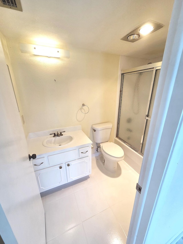 1731 Presidential Way Unit C201, West Palm Beach, FL 33401 - full bath featuring tile patterned flooring, vanity, and shower / bath combination with glass door