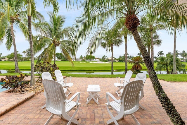 2150 SE Golfview Ln, Stuart, FL 34996 - view of patio with golf course view and a water view