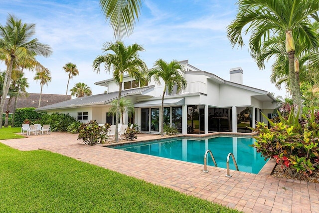 2150 SE Golfview Ln, Stuart, FL 34996 - swimming pool with a patio area and a lawn