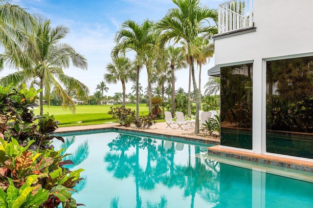 2150 SE Golfview Ln, Stuart, FL 34996 - outdoor pool featuring a lawn