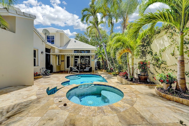 17233 Bermuda Village Dr, Boca Raton, FL 33487 - view of pool featuring a patio, a fenced backyard, and a pool with connected hot tub