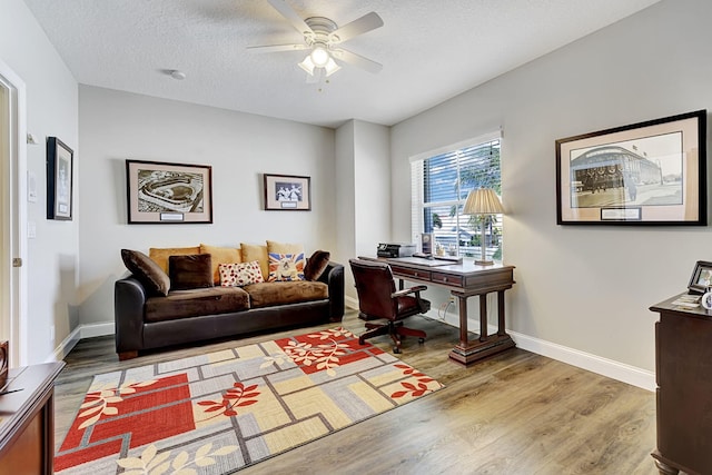 17233 Bermuda Village Dr, Boca Raton, FL 33487 - office area featuring ceiling fan, wood finished floors, baseboards, and a textured ceiling