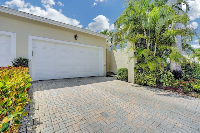 17233 Bermuda Village Dr, Boca Raton, FL 33487 - garage featuring decorative driveway