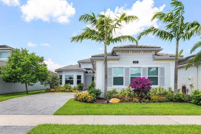 13487 Whistler Mountain Rd, Delray Beach, FL 33446 - view of front of property with stucco siding, a tile roof, and a front lawn