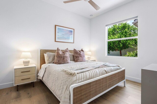 13487 Whistler Mountain Rd, Delray Beach, FL 33446 - bedroom featuring baseboards, wood finished floors, and ceiling fan