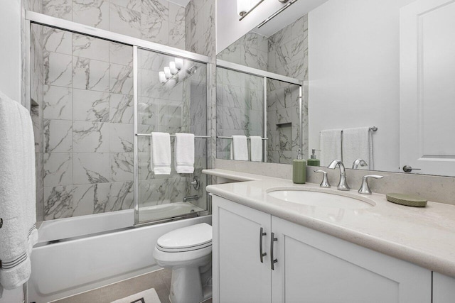 13487 Whistler Mountain Rd, Delray Beach, FL 33446 - bathroom featuring vanity, shower / bath combination with glass door, and toilet