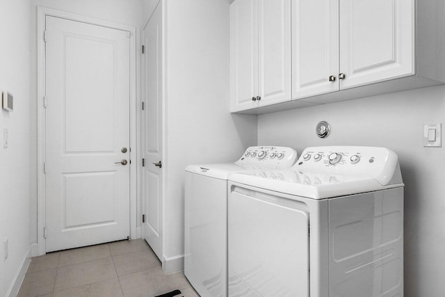 13487 Whistler Mountain Rd, Delray Beach, FL 33446 - laundry room featuring baseboards, washing machine and clothes dryer, cabinet space, and light tile patterned flooring