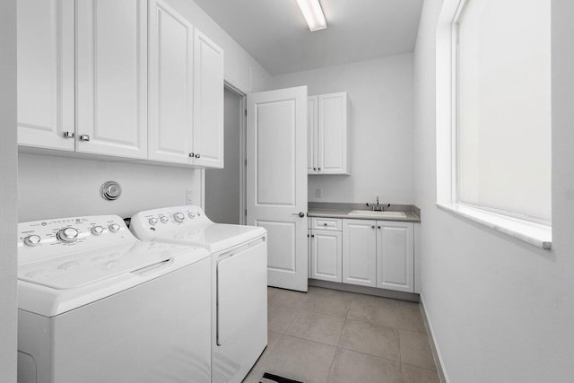 13487 Whistler Mountain Rd, Delray Beach, FL 33446 - washroom featuring cabinet space, washer and clothes dryer, light tile patterned flooring, and baseboards