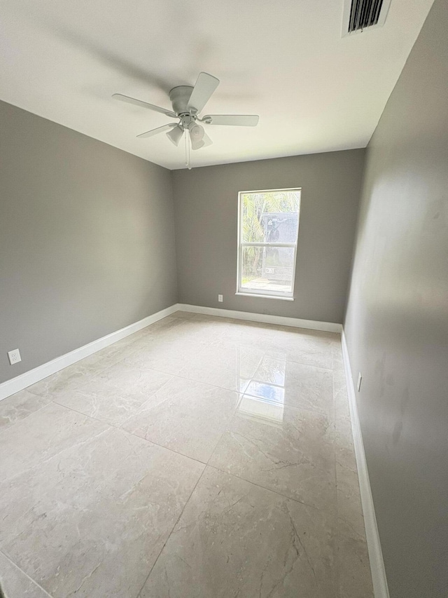 324W W 5th Ter, Pahokee, FL 33476 - unfurnished room featuring baseboards and ceiling fan