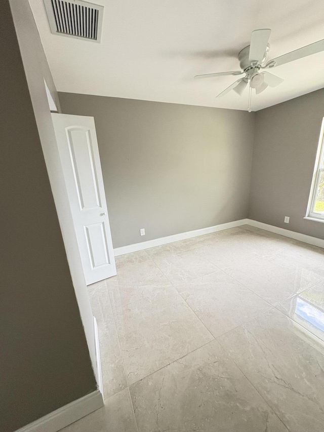324W W 5th Ter, Pahokee, FL 33476 - unfurnished room with baseboards and a ceiling fan
