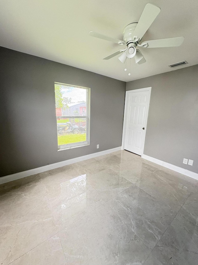 324W W 5th Ter, Pahokee, FL 33476 - spare room with ceiling fan and baseboards