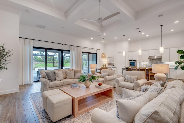 314 Sonoma Isles Cir, Jupiter, FL 33478 - living room featuring coffered ceiling, beam ceiling, recessed lighting, ornamental molding, and light wood finished floors