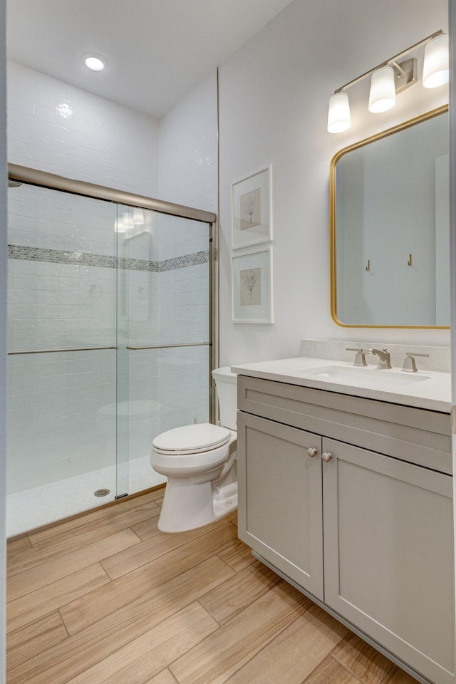 314 Sonoma Isles Cir, Jupiter, FL 33478 - full bath featuring toilet, vanity, a stall shower, and wood finished floors