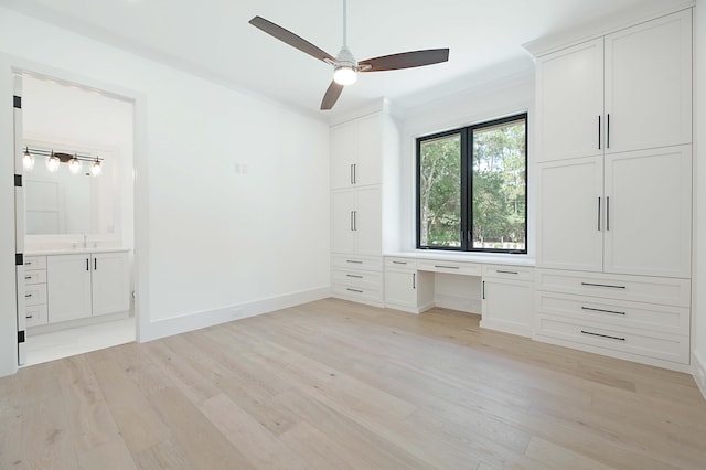 18072 127th Dr N, Jupiter, FL 33478 - unfurnished bedroom featuring light wood finished floors, a sink, ensuite bathroom, and baseboards
