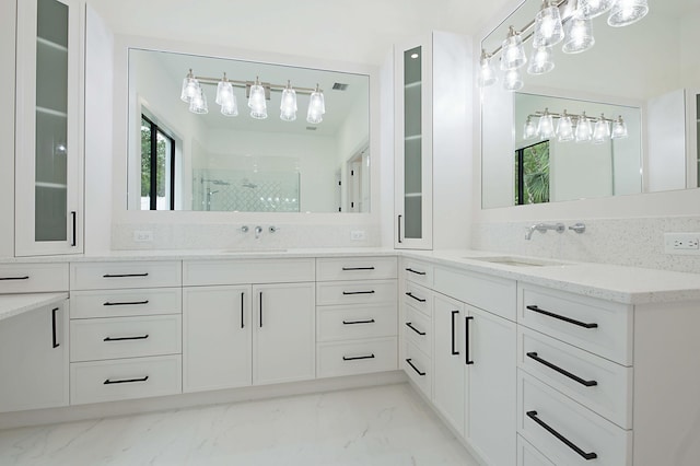 18072 127th Dr N, Jupiter, FL 33478 - full bathroom with marble look tiles, double vanity, and a walk in shower