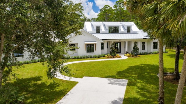 18072 127th Dr N, Jupiter, FL 33478 - modern farmhouse with a front lawn, stucco siding, a porch, and metal roof
