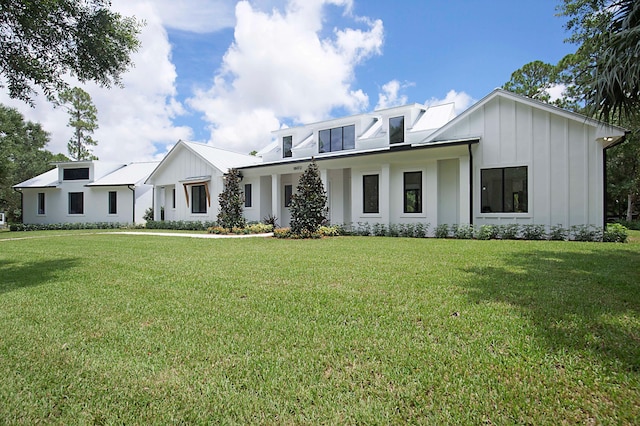 18072 127th Dr N, Jupiter, FL 33478 - modern farmhouse featuring board and batten siding and a front lawn