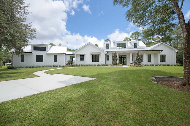 18072 127th Dr N, Jupiter, FL 33478 - modern farmhouse style home featuring a front yard and stucco siding