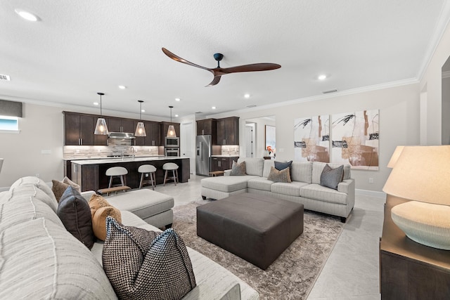 10339 SW Tetian Dr, Port Saint Lucie, FL 34987 - living area featuring ceiling fan, recessed lighting, crown molding, and baseboards