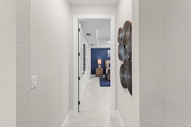 10339 SW Tetian Dr, Port Saint Lucie, FL 34987 - corridor featuring a textured wall, baseboards, and light tile patterned floors