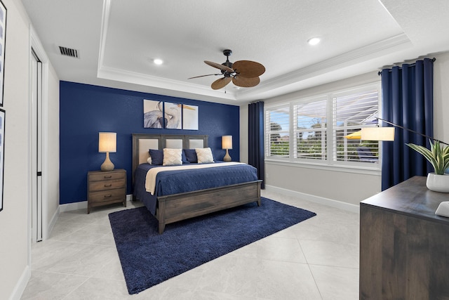 10339 SW Tetian Dr, Port Saint Lucie, FL 34987 - bedroom featuring a tray ceiling, light tile patterned floors, crown molding, baseboards, and ceiling fan