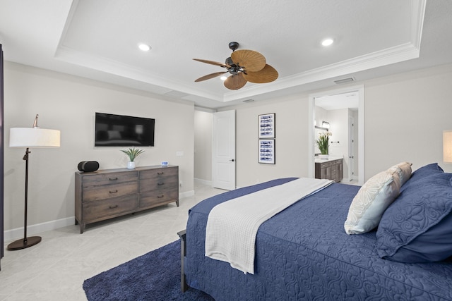 10339 SW Tetian Dr, Port Saint Lucie, FL 34987 - bedroom featuring a tray ceiling, baseboards, recessed lighting, ensuite bath, and crown molding