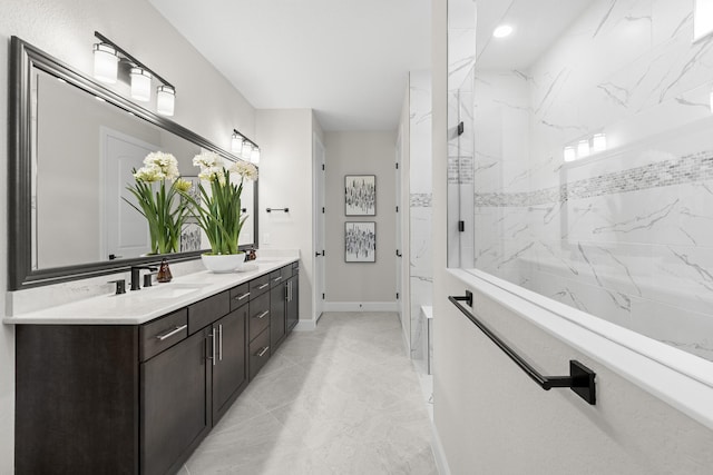 10339 SW Tetian Dr, Port Saint Lucie, FL 34987 - bathroom featuring double vanity, a marble finish shower, marble look tiles, baseboards, and recessed lighting