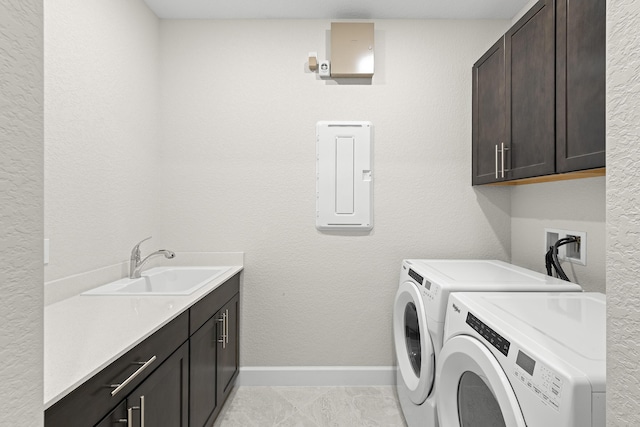 10339 SW Tetian Dr, Port Saint Lucie, FL 34987 - washroom with cabinet space, washer and clothes dryer, electric panel, and baseboards