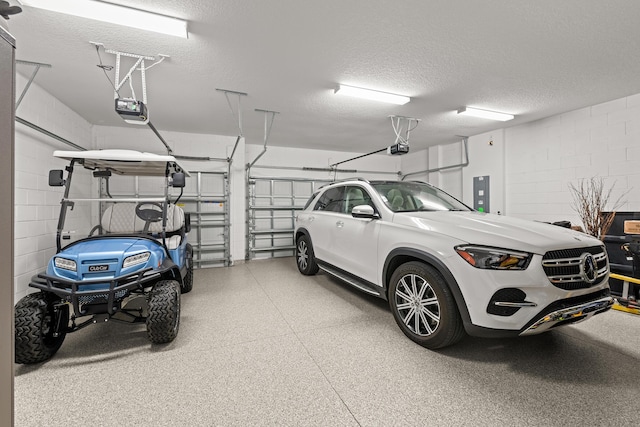 10339 SW Tetian Dr, Port Saint Lucie, FL 34987 - garage featuring a garage door opener, concrete block wall, and electric panel