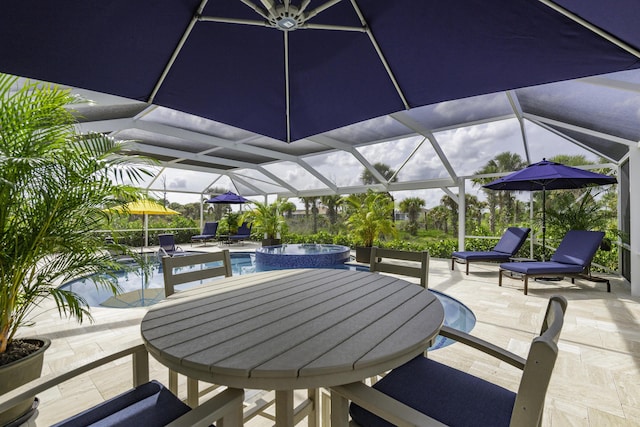 10339 SW Tetian Dr, Port Saint Lucie, FL 34987 - view of patio featuring a pool with connected hot tub, outdoor dining space, and glass enclosure