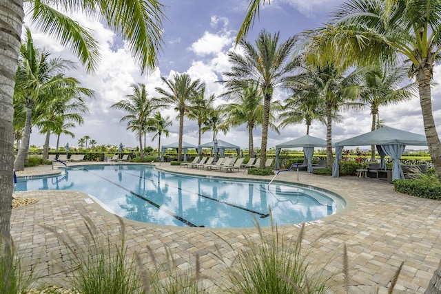 10339 SW Tetian Dr, Port Saint Lucie, FL 34987 - community pool featuring a gazebo and a patio area