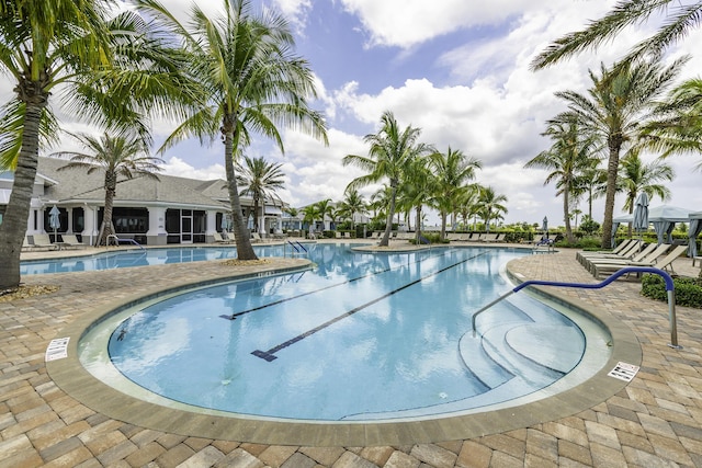 10339 SW Tetian Dr, Port Saint Lucie, FL 34987 - community pool featuring a patio area