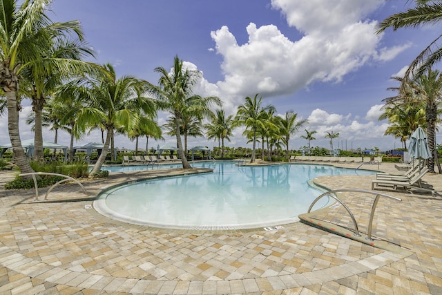 10339 SW Tetian Dr, Port Saint Lucie, FL 34987 - community pool featuring a patio area