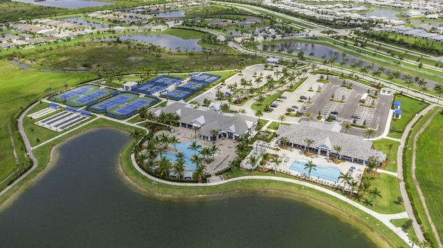 10339 SW Tetian Dr, Port Saint Lucie, FL 34987 - aerial overview of property's location featuring a large body of water and a pool area