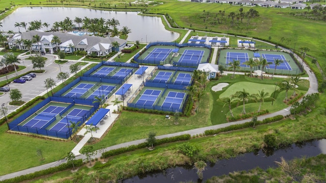 10339 SW Tetian Dr, Port Saint Lucie, FL 34987 - aerial view of property and surrounding area with a large body of water and nearby suburban area
