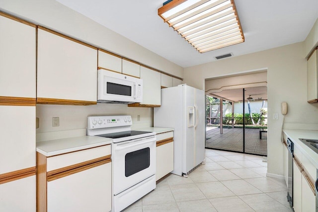 16703 Hidden Cove Dr, Jupiter, FL 33477 - kitchen featuring white appliances, light countertops, and white cabinetry