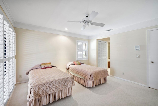 16703 Hidden Cove Dr, Jupiter, FL 33477 - bedroom with crown molding, light colored carpet, baseboards, a closet, and a ceiling fan