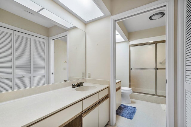 16703 Hidden Cove Dr, Jupiter, FL 33477 - bathroom with a closet, toilet, vanity, a shower stall, and tile patterned floors