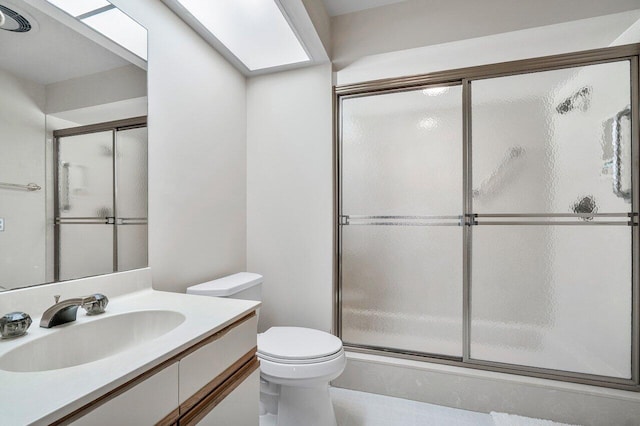 16703 Hidden Cove Dr, Jupiter, FL 33477 - bathroom with a skylight, a stall shower, vanity, and toilet