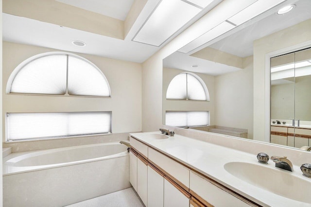 16703 Hidden Cove Dr, Jupiter, FL 33477 - full bath with a garden tub, double vanity, and recessed lighting