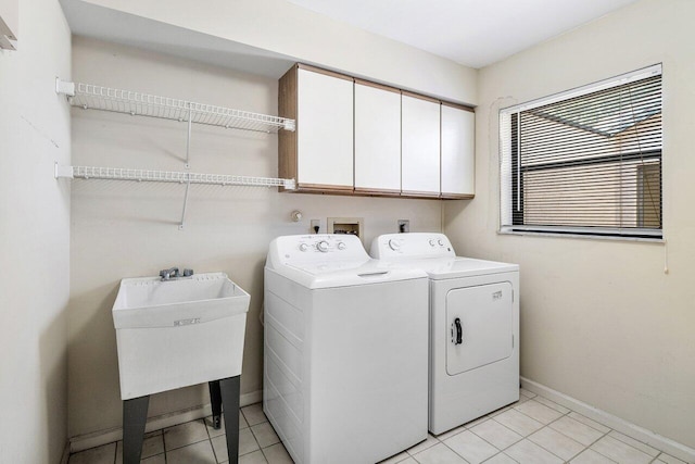 16703 Hidden Cove Dr, Jupiter, FL 33477 - laundry room with cabinet space, washing machine and dryer, baseboards, and light tile patterned floors
