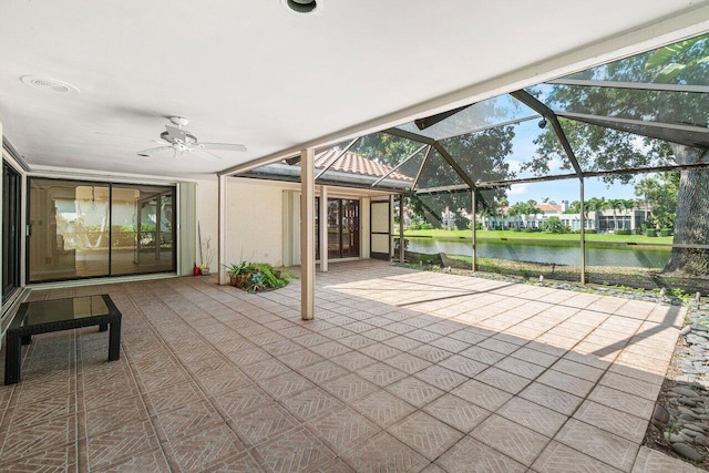 16703 Hidden Cove Dr, Jupiter, FL 33477 - view of patio featuring a water view, a ceiling fan, and a lanai
