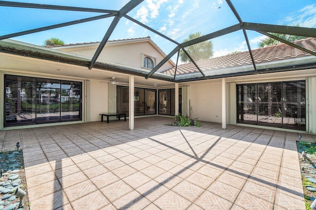 16703 Hidden Cove Dr, Jupiter, FL 33477 - view of patio / terrace featuring a ceiling fan and glass enclosure